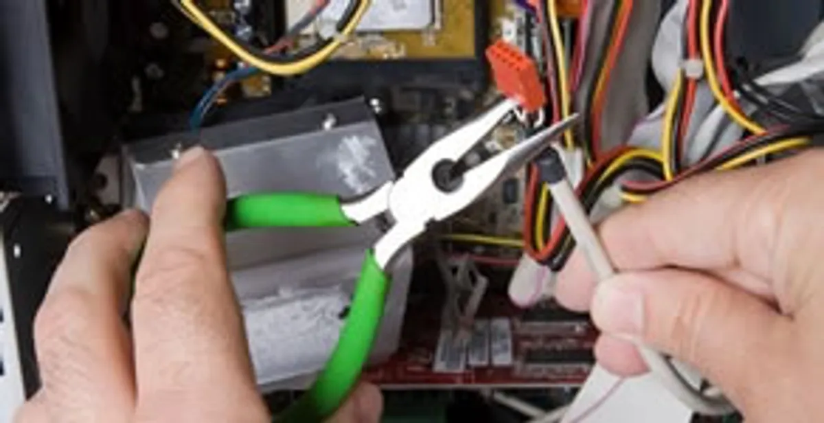 Licensed electrical contractor performing electrical repair with tools in Rohnert Park, CA